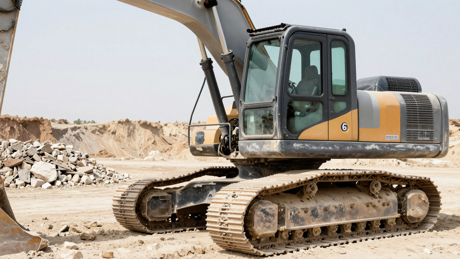 Technician servicing condenser unit on an excavator with accessible mounting